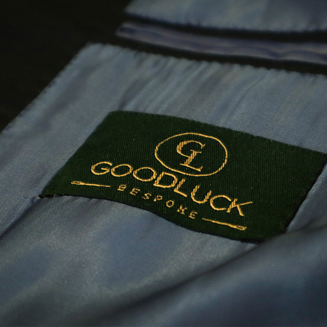 Goodluck Bespoke's logo inside of the suit
